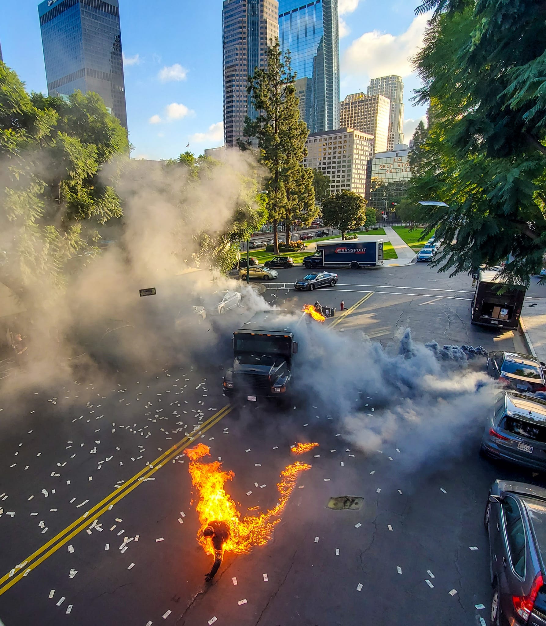 Full-body fire burn stunt on set — downtown city street explosion