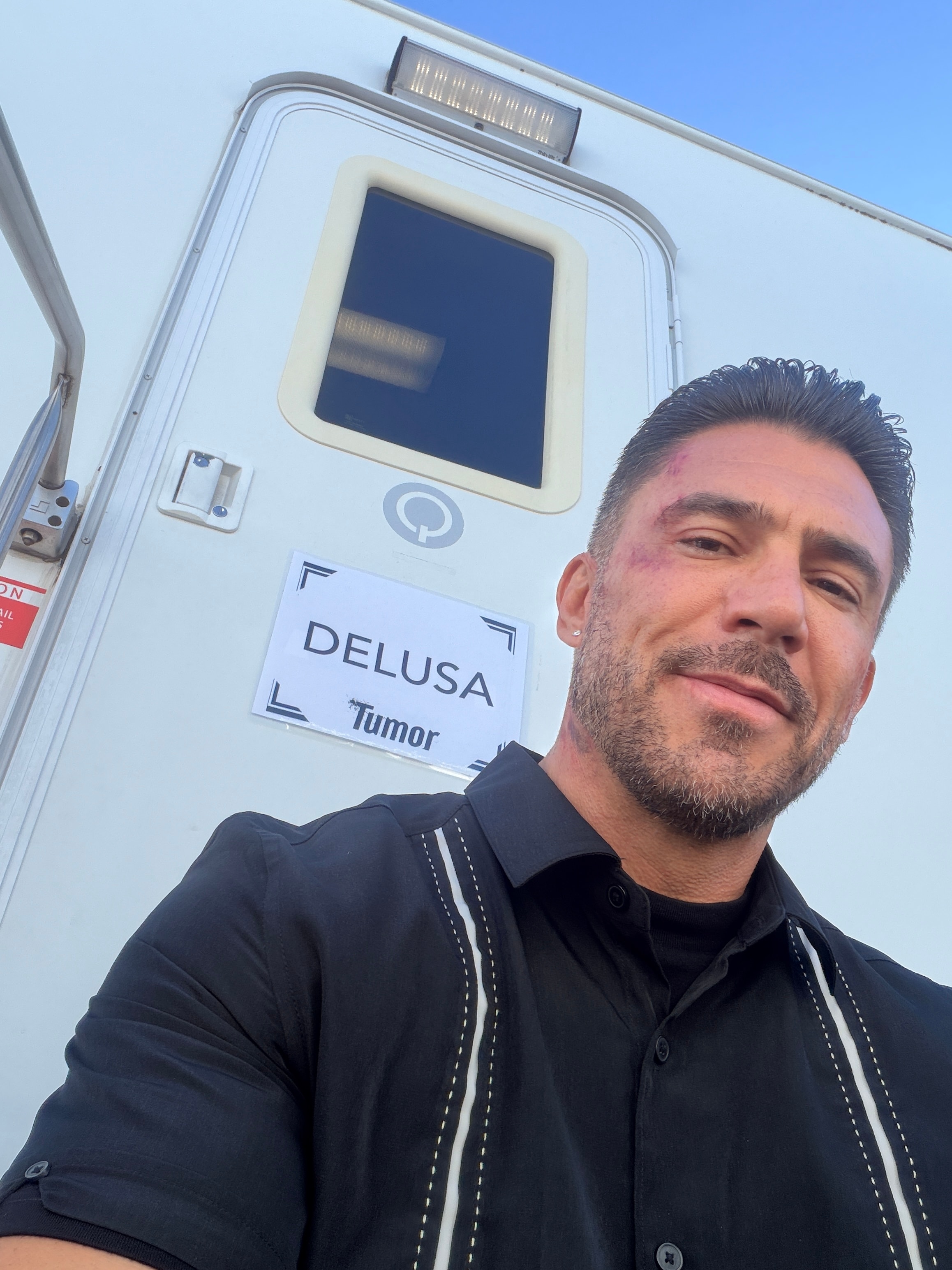 Chad Guerrero on set next to production vehicle